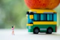 Miniature people : Children going to school by school bus in the first time Royalty Free Stock Photo