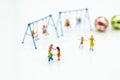 Miniature people : children playing together. Image use for happy family day concept