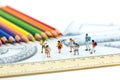 Miniature people : children and student with colorful drawing to Royalty Free Stock Photo