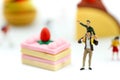 Miniature people : children,student with dessert.fun and food co Royalty Free Stock Photo