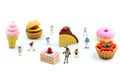 Miniature people : children,student with dessert.fun and food co Royalty Free Stock Photo