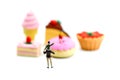 Miniature people : children,student with dessert.fun and food co Royalty Free Stock Photo