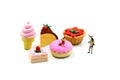 Miniature people : children,student with dessert.fun and food co Royalty Free Stock Photo