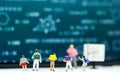 Miniature people : children and teacher with math blackboard background. Back to school concept.