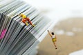 Miniature people: Climber climbing on book . Image use for learning, education concept