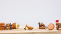 Miniature people : Close up workers work on sausages