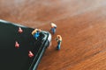 Miniature people Construction worker  repair smartphone using as background Maintenance concept and repair concept with copy space Royalty Free Stock Photo