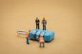 Miniature people Construction worker Security Key Repair And the treatment of the precious. on white background using as Royalty Free Stock Photo