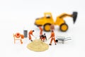 Miniature people: Construction workers building plans , have building materials, sand, brick, mortar. Use image for construction