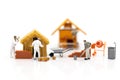 Miniature people: Construction workers building plans , have building materials, sand, brick, mortar. Use image for construction