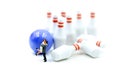 Miniature people : couple of love with bowling pin and ball,playing lover concept. Royalty Free Stock Photo