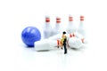 Miniature people : couple of love with bowling pin and ball,playing lover concept. Royalty Free Stock Photo