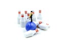 Miniature people : couple of love with bowling pin and ball,playing lover concept. Royalty Free Stock Photo