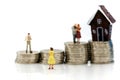 Miniature people : Couple of love with Stack of coins and mini h Royalty Free Stock Photo