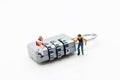 Miniature people are decrypting unlock padlock, Decrypt the key. concept for data security breach, risk and hacker attack