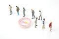 Miniature people. different people are standing near the compass. finding direction in life Royalty Free Stock Photo
