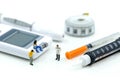 Miniature people : Doctor and Patient with Insulin pen ,Diabetes equipment ,glucose level blood test,Diabetes concept