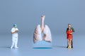 Miniature Doctors study and treat large human lungs, World Health Day concept