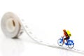 Miniature people enjoy riding a bicycle. Cycling for health Concept