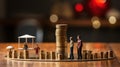 Miniature people: family on coins stack. Business and finance concept