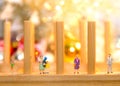 Miniature people with family holding balloon with party on Merry Christmas Royalty Free Stock Photo