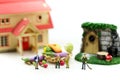 Miniature people : Farmer gardener in action with market,Farm Local Market Concep