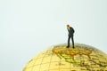 Miniature people figure businessman standing on united states of Royalty Free Stock Photo