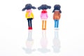 miniature people. figures for the game. cute girlfriends together on white background