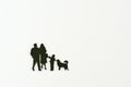 Miniature people flat in black, father, mother,son and dog on white background with copy space. In concept family