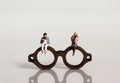 Miniature people and miniature glasses.