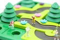 Miniature people : golfer stand with children`s toys collection,