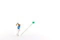 Miniature people: Golfers hit golf balls forward. Target and growth in business concept
