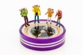 Miniature people: Group of backpacker standing on compass ,using as background travel, business concept. Royalty Free Stock Photo