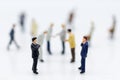 Miniature people: Group businessman negotiates business, planning. Image use for business concept