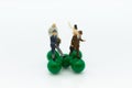 Miniature people: Group Businessman standing on plastic green. Image use for work with team, business concept.