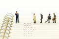 Miniature people, Group of businessmen work with team, using as background Choice of the best suited employee, Royalty Free Stock Photo