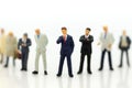 Miniature people, Group of businessmen work with team, using as background Choice of the best suited employee,