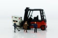 Miniature people : Group people auto insurance when an accident on the road. Image use for Make an agreement, responsibility Royalty Free Stock Photo