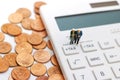 Miniature people: Happy old people standing on calculator with coins stack, Retirement planning, Emergency plan, Life insurance Royalty Free Stock Photo