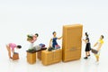 Miniature people : Housewives hire laundry - ironing, profitable business. Image use for housework, business concept Royalty Free Stock Photo