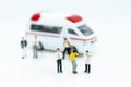 Miniature people : Injured personal from road accidents, ambulance transported to the hospital for treatment. Royalty Free Stock Photo