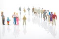 miniature people. little girl with other people stands against the background of other people on a white background. Loneliness