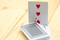 Miniature people : maid clean a heart of Playing cards.