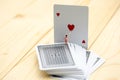 Miniature people : maid clean a heart of Playing cards.