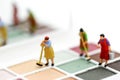 Miniature people : Maid or Housewife cleaning on Makeup products Royalty Free Stock Photo