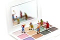 Miniature people : Maid or Housewife cleaning on Makeup products Royalty Free Stock Photo