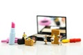 Miniature people : Maid or Housewife cleaning on Makeup products Royalty Free Stock Photo