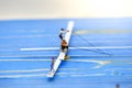 Miniature people : man fishing on a lake from the boat Royalty Free Stock Photo