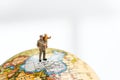 Miniature people man holding his baby son standing on China map on globe with white copy space using as China economic prosperity Royalty Free Stock Photo