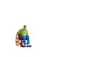 Miniature people Man in wheelchair isolated with clipping path Royalty Free Stock Photo